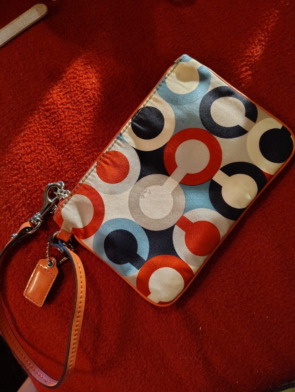 Colorful Circle Print Wristlet Clutch in Orange, Navy & Cream